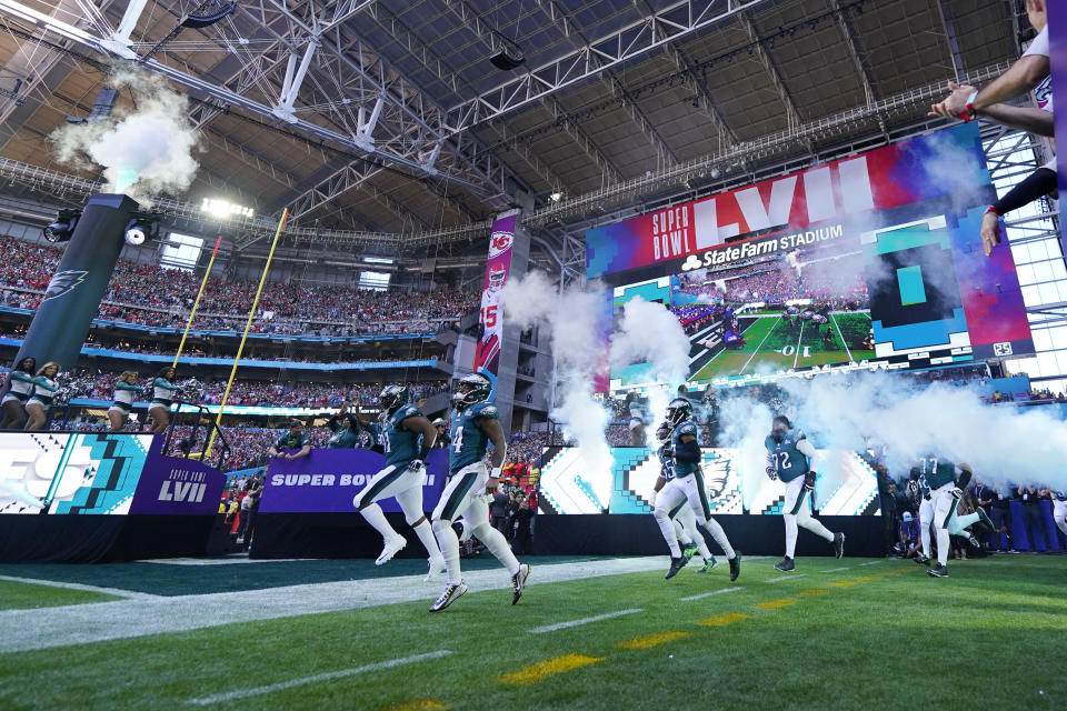 Philadelphia Eagles players enter the field before the NFL Super Bowl 57 football game between the Kansas City Chiefs and the Philadelphia Eagles, Sunday, Feb. 12, 2023, in Glendale, Ariz. (AP Photo/Matt Slocum)