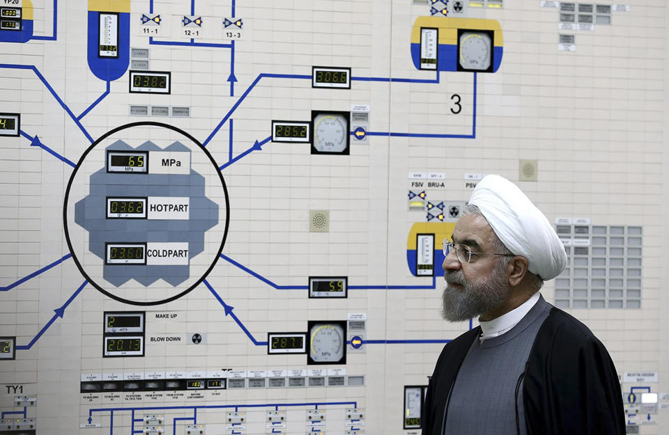FILE - In this Jan. 13, 2015, file photo released by the Iranian President's Office, President Hassan Rouhani visits the Bushehr nuclear power plant just outside of Bushehr, Iran. Iran announced Saturday, Sept. 7, 2019, it had begun using advanced centrifuges in violation of its 2015 nuclear deal with world powers. (AP Photo/Iranian Presidency Office, Mohammad Berno, File)