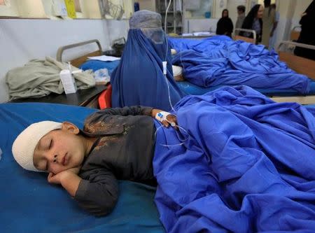An Afghan boy wounded in an airstrike receives treatment at a hospital in Jalalabad, Afghanistan October 28, 2016. REUTERS/Parwiz