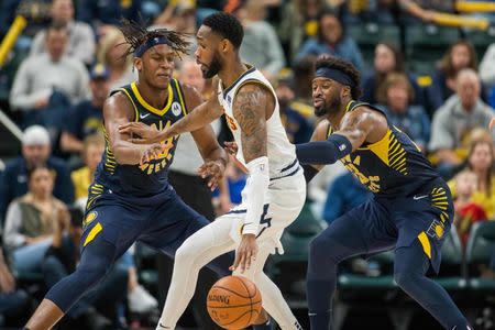 Mar 24, 2019; Indianapolis, IN, USA; Denver Nuggets guard Will Barton (5) is is defended by Indiana Pacers center Myles Turner (33) and guard Wesley Matthews (23) in the second half at Bankers Life Fieldhouse. Mandatory Credit: Trevor Ruszkowski-USA TODAY Sports