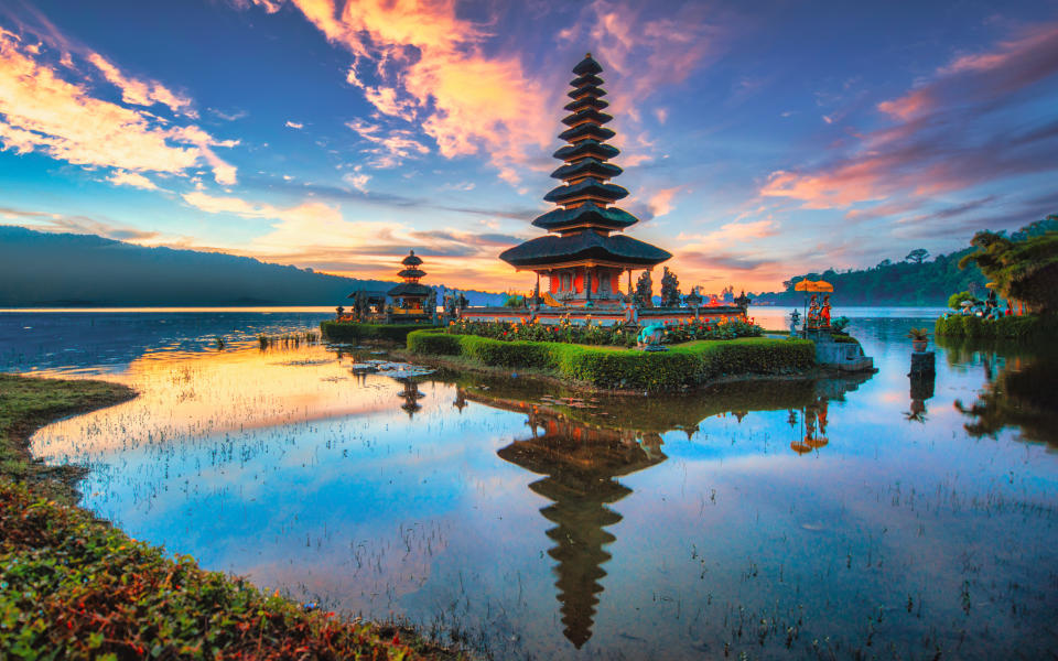 Travel destination Pura Ulun Danu Bratan. Hindu temple on Bratan lake landscape. One of famous tourist attraction in Bali. Indonesia