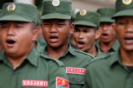 United Wa State Army (UWSA) soldiers march during a media display in Pansang, Wa territory in northeast Myanmar October 4, 2016. Picture taken on October 4, 2016. REUTERS/Soe Zeya Tun