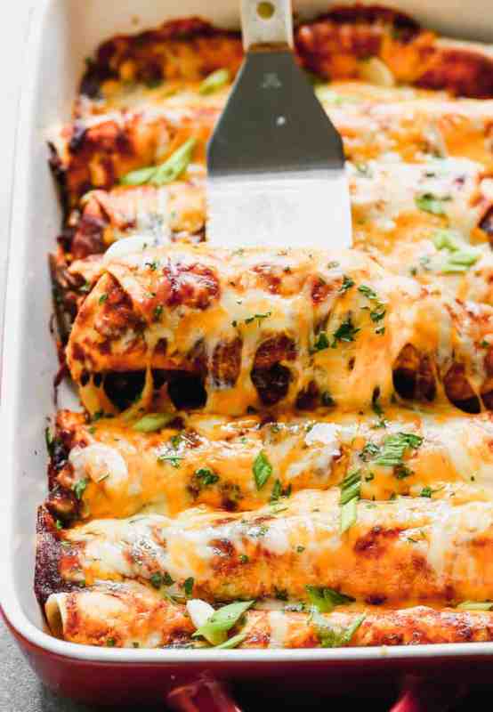 <p>Tastes Better from Scratch</p><p>Beef enchiladas made with tender shredded beef cooked in a simple homemade enchilada sauce, then layered in tortillas and cheese to make delectable enchiladas.</p><p><strong>Get the recipe: <a href="https://tastesbetterfromscratch.com/slow-cooker-shredded-beef-enchiladas/" rel="nofollow noopener" target="_blank" data-ylk="slk:Slow Cooker Shredded Beef Enchiladas;elm:context_link;itc:0;sec:content-canvas" class="link rapid-noclick-resp">Slow Cooker Shredded Beef Enchiladas</a></strong></p>