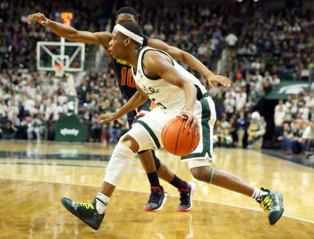 Jan 21, 2019; East Lansing, MI, USA; Michigan State Spartans guard Cassius Winston (5) is defended by Maryland Terrapins guard Serrel Smith Jr. (10) during the second half of a game at the Breslin Center. Mandatory Credit: Mike Carter-USA TODAY Sports