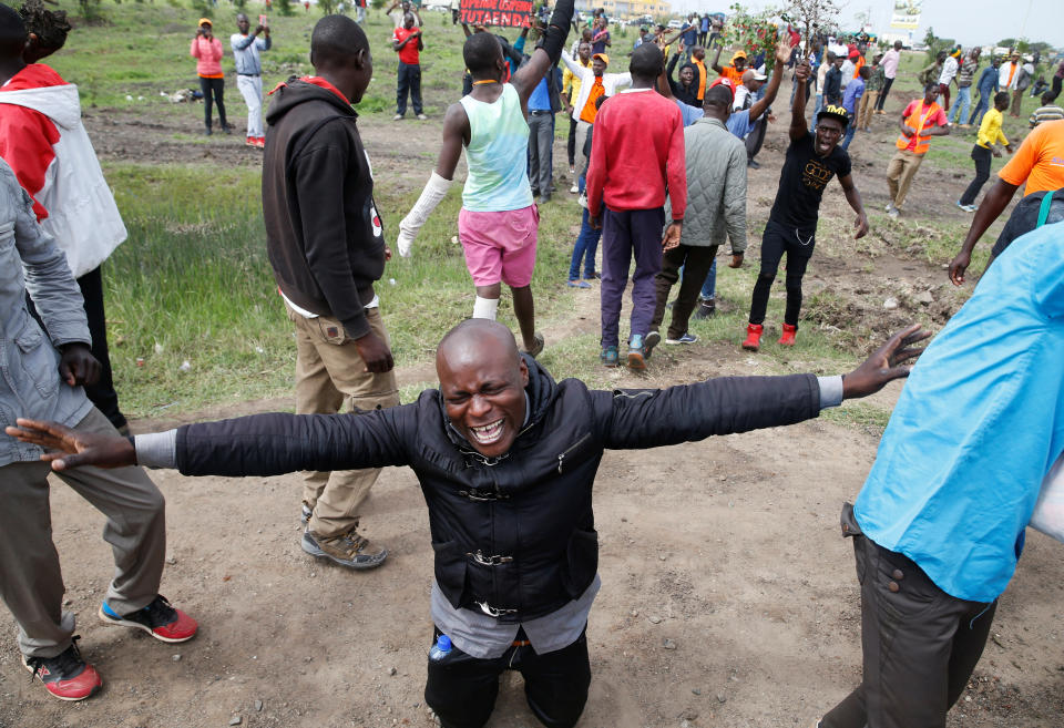 <p>A supporter of Kenyan opposition leader Raila Odinga of the National Super Alliance (NASA) coalition reacts as he attempts to access the Jomo Kenyatta airport upon Odinga’s return in Nairobi, Kenya, Nov. 17, 2017. (Photo: Baz Ratner/Reuters) </p>