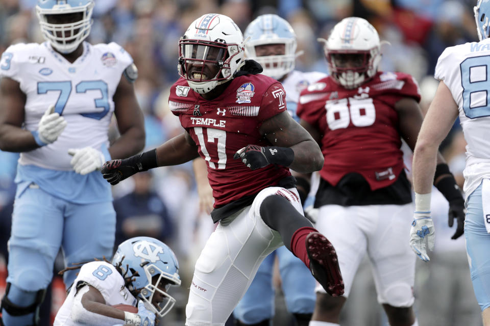 Temple defensive end Dana Levine (17) celebrates after making a tackle on North Carolina running back Michael Carter (8) during the first half of the Military Bowl NCAA college football game, Friday, Dec. 27, 2019, in Annapolis, Md. (AP Photo/Julio Cortez)