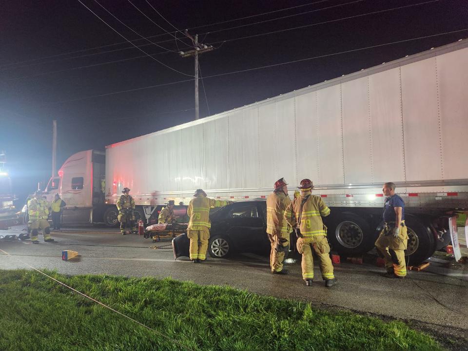 Emergency responders rescued a person trapped in a car that became wedged underneath a tractor-trailer during a crash early Monday morning, according to Hanover Area Fire & Rescue.