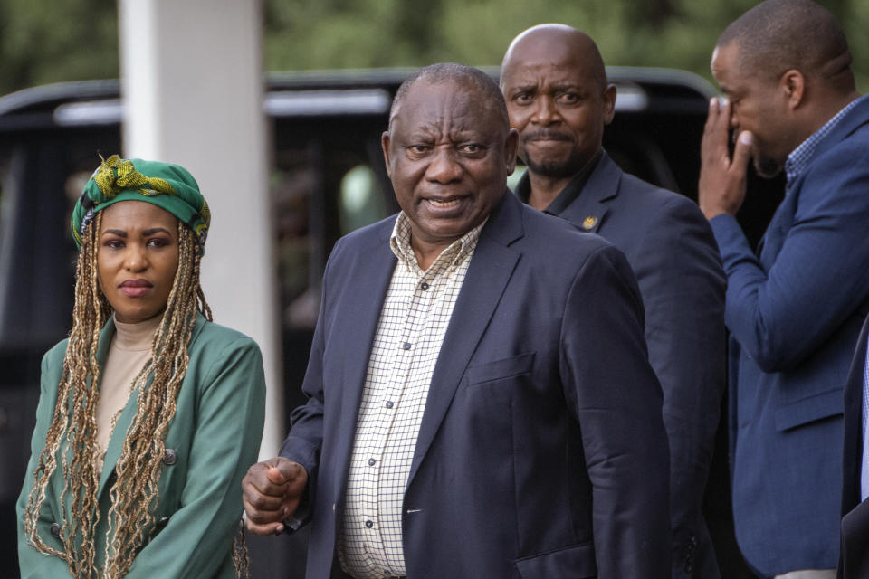 South African President Cyril Ramaphosa leaves an African National Congress (ANC) national executive committee meeting in Johannesburg, South Africa, Monday Dec. 5, 2022. Ramaphosa might lose his job, and his reputation as a corruption fighter, as he faces possible impeachment over claims that he tried to cover up the theft of millions of dollars stashed inside a couch on his farm. (AP Photo/Jerome Delay)