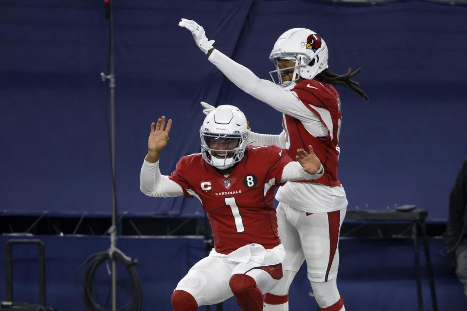 Arizona Cardinals' Kyler Murray (1) and DeAndre Hopkins, right, celebrate a touchdown scored on a carry by Murray in the second half of an NFL football game against the Dallas Cowboys in Arlington, Texas, Monday, Oct. 19, 2020. (AP Photo/Ron Jenkins)