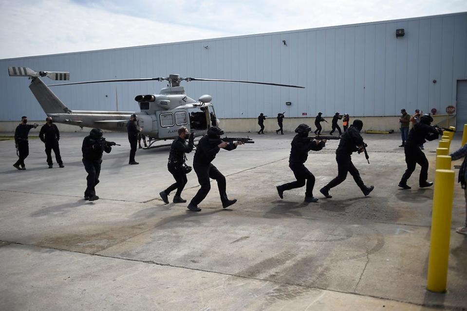 Actors portraying commandos rehearse a scene for the movie, "Agent Game", that was filmed in Evans, Ga.