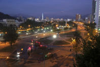 Plaza Italia is empty after a curfew went into effect, after another day of demonstrations triggered by an increase in subway fares in Santiago, Chile, Monday, Oct. 21, 2019. Protesters defied an emergency decree and confronted police in Chile's capital on Monday, continuing disturbances that have left at least 11 dead. (AP Photo/Luis Hidalgo)