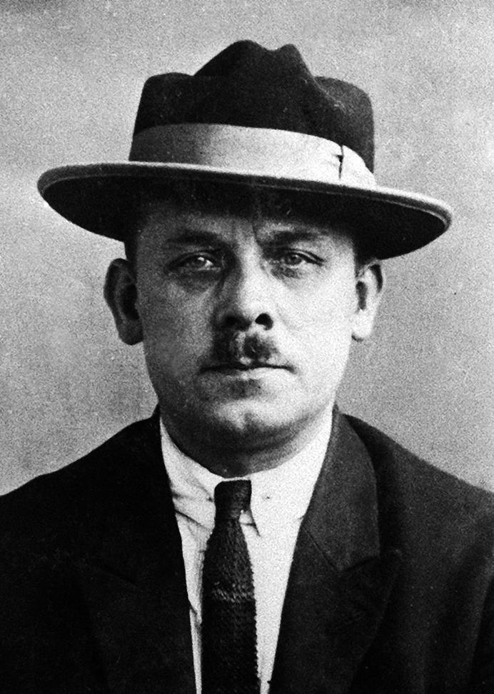 Fritz Haarmann, a mustachioed man wearing a brim hat and a tie.