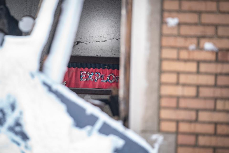 Southwestern High School in southwest Detroit is in the final phase of being demolished on Jan. 26, 2023. A tiny hole in the wall reveals what is left on a classroom wall.