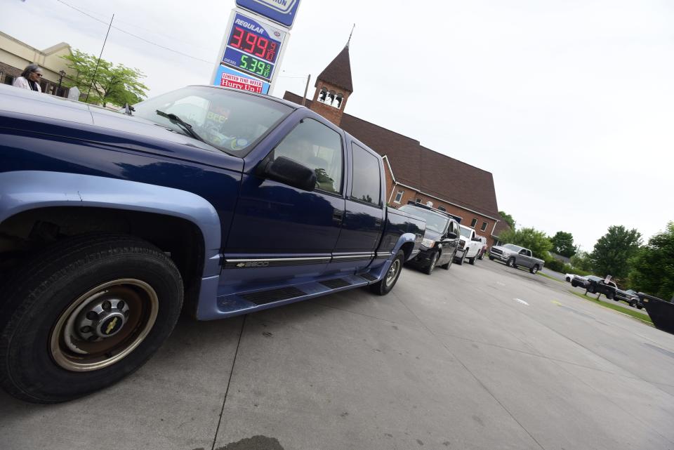 Vehicles line up to get a chance to fill up on gas at the Marathon gas station in Lexington on Monday, June 6, 2022. The gas station offered $1 off per gallon beginning at 10 a.m. through People Helping People, an initiative supported through donations from local businesses.