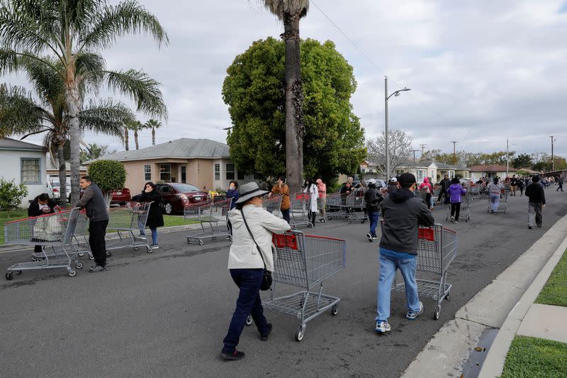 Hundreds of shoppers line-up for blocks waiting to purchase supplies at a Costco due to the global outbreak of coronavirus in Garden Grove, California