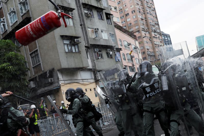 Pictures of the Year: Hong Kong protest tide turns into sea of flames