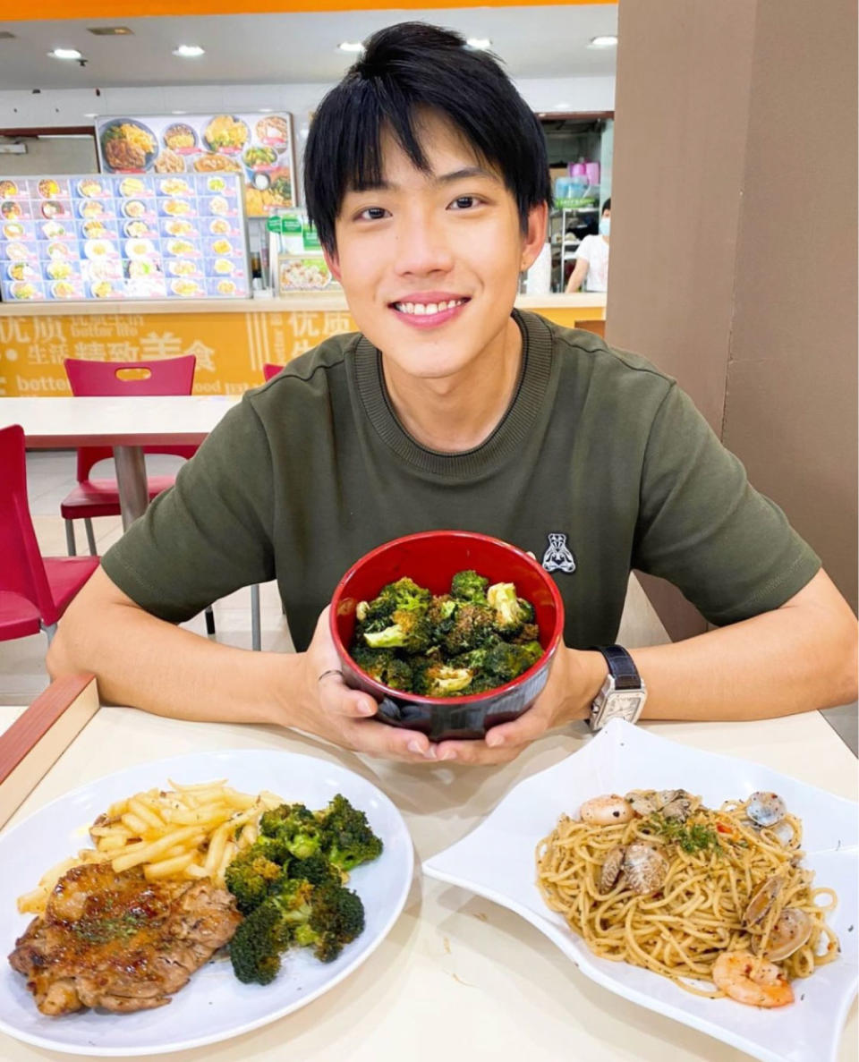 Ben Tan posing with food from chef buI bui