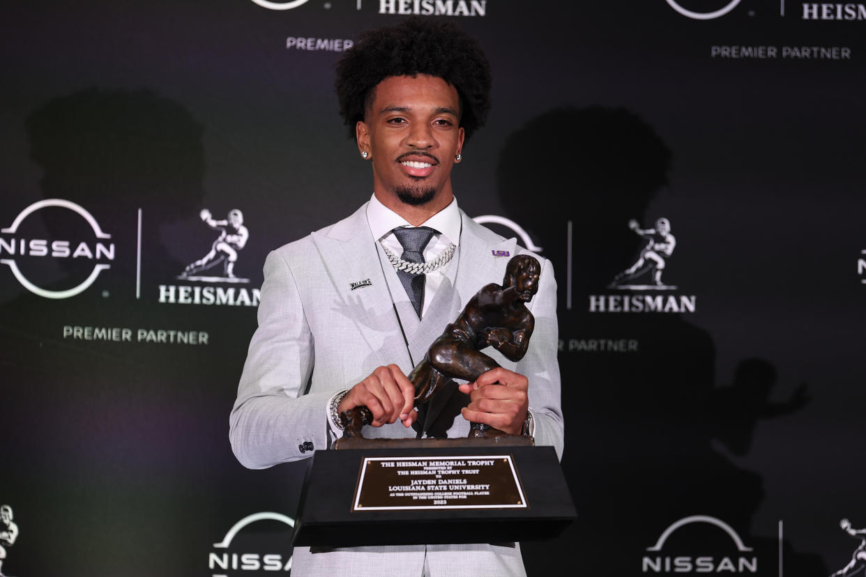 NEW YORK, NY - DECEMBER 09: Jayden Daniels quarterback LSU poses with the Heisman Trophy after winning it at the press conference at the New York Marriott Marquis on December 9, 2023 in New York City, New York.  (Photo by Rich Graessle/Icon Sportswire via Getty Images)