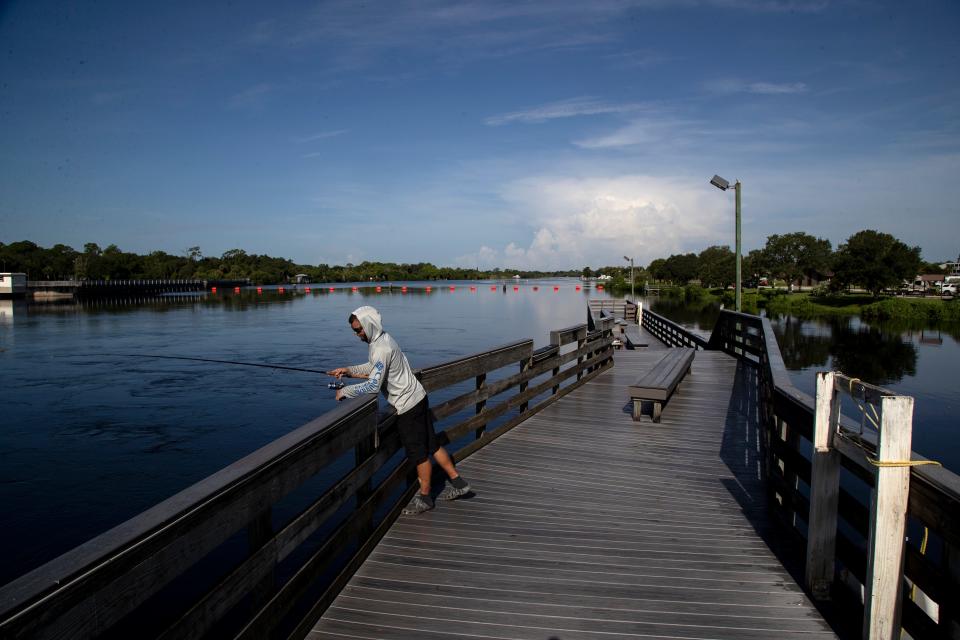 Alex Ramos fishes for tarpon in the Caloosahatchee River at the W. P. Franklin Lock on Friday, Sept. 2, 2022.