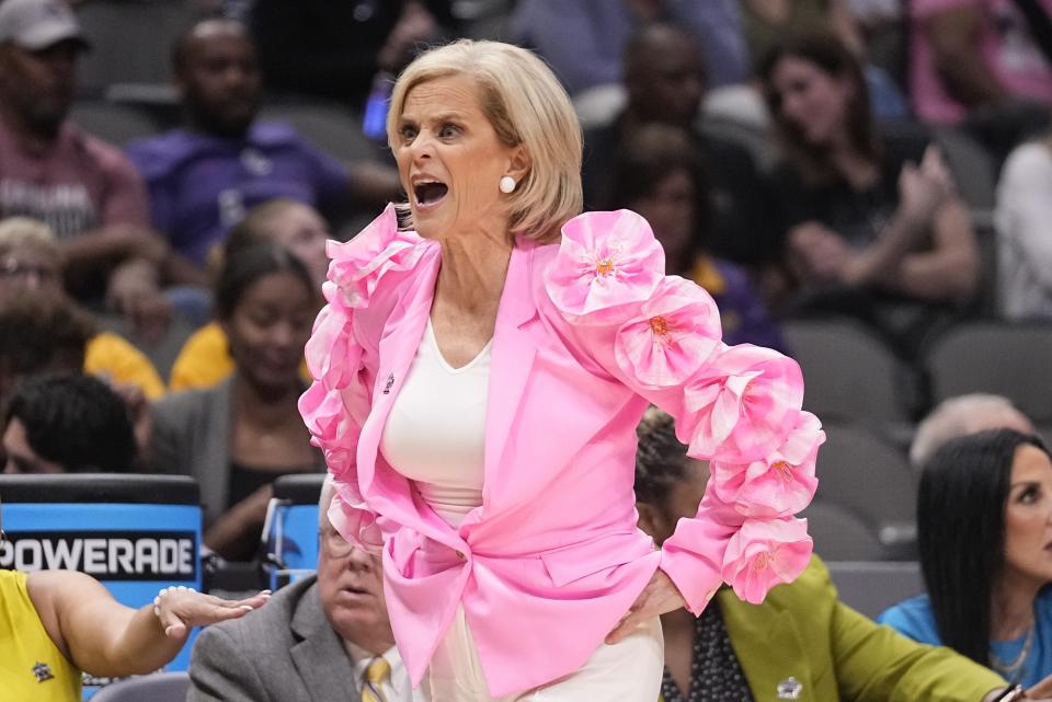 LSU head coach Kim Mulkey reacts during the first half of an NCAA Women's Final Four semifinals basketball game against Virginia Tech Friday, March 31, 2023, in Dallas. (AP Photo/Darron Cummings)