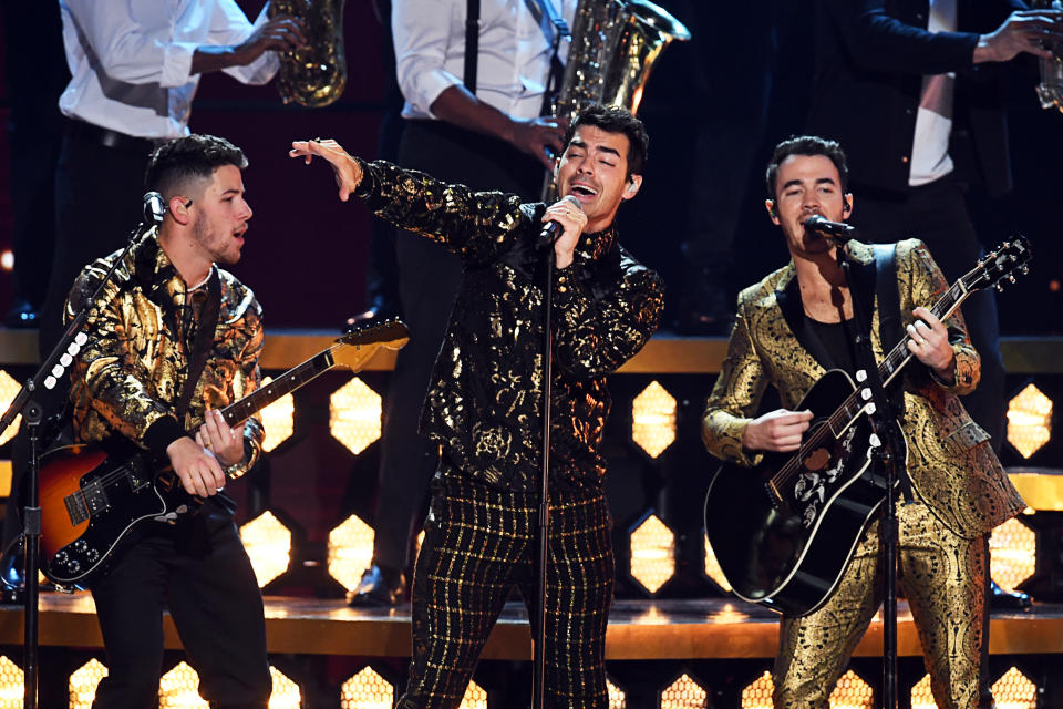 Nick Jonas, Joe Jonas, and Kevin Jonas of the Jonas Brothers perform onstage during the 62nd annual Grammy Awards in Los Angeles. - Credit: Getty Images for The Recording A