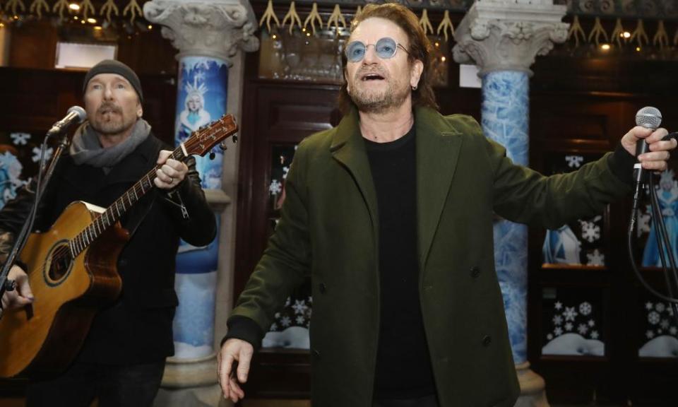 The Edge and Bono of U2 take part in the annual Christmas Eve busk in Dublin. 