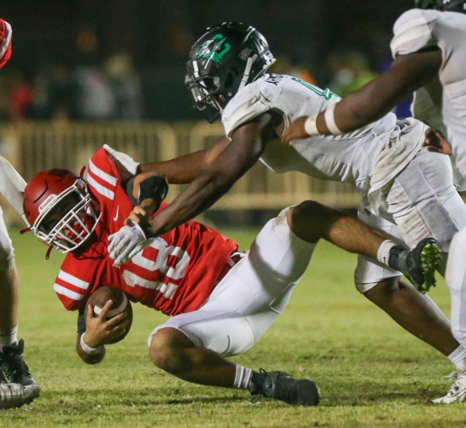 Choctaw LB Jashawn Armstrong sacks Crestview QB Nathaniel Nocher during the Crestview-Choctaw football game at Crestview.