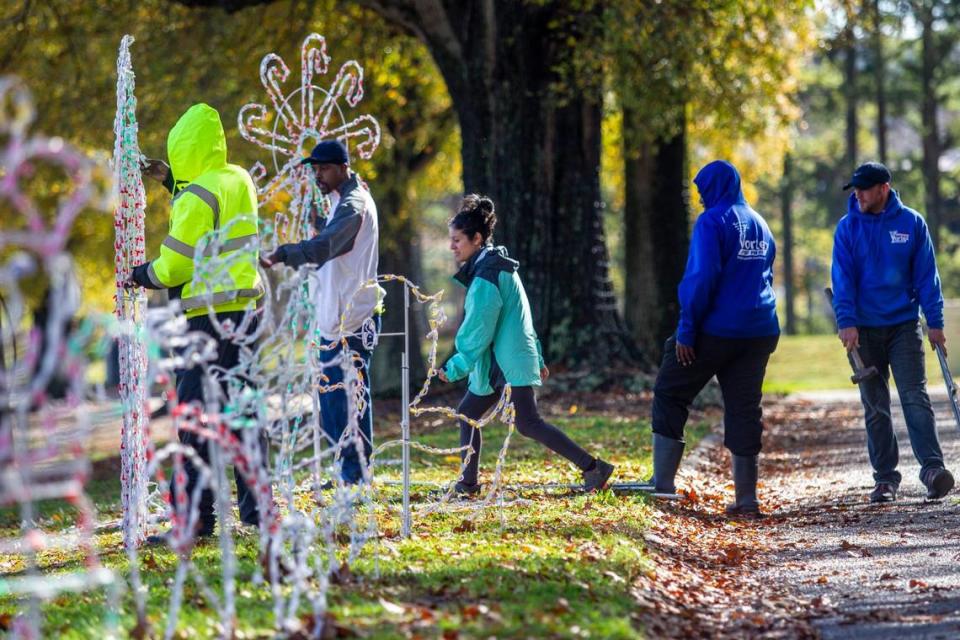 A crew installs Christmas lights on a 1.3 mile route at Dorothea Dix Park. Monday, Nov. 30, 2020. The drive-thru holiday light show sponsored by WRAL in partnership with the City of Raleigh will operate nightly from November 25 through December 24, 2022. 