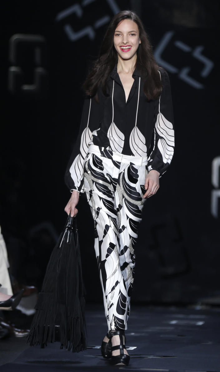The Diane von Furstenberg Fall 2013 collection is modeled during Fashion Week in New York, Sunday, Feb. 10, 2013. (AP Photo/Seth Wenig)