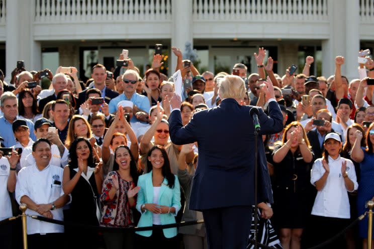 Employees of Donald Trump stand behind him in support at a campaign event at his Trump National Doral golf club outside Miami, Oct. 25, 2016. (Jonathan Ernst/Reuters)