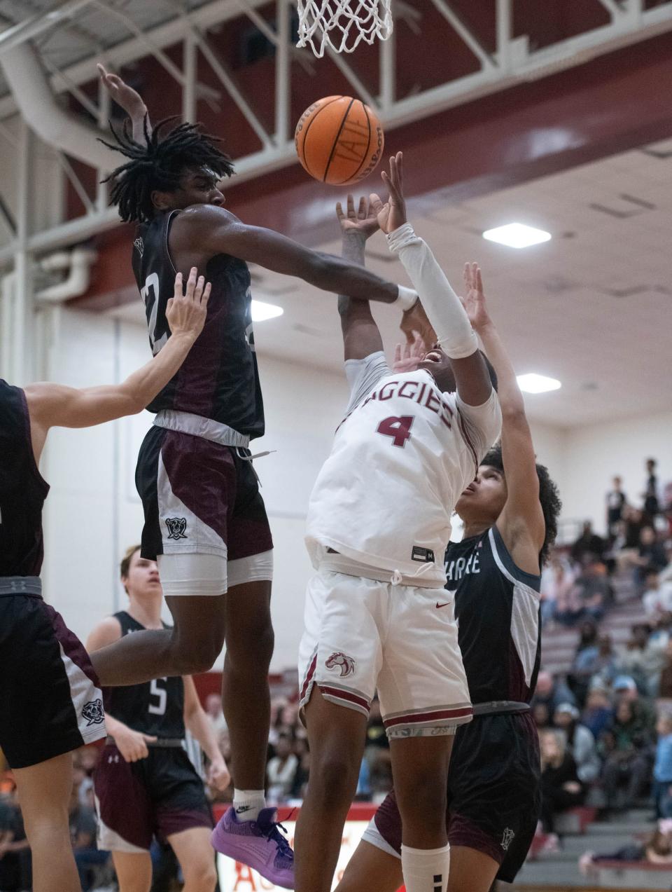 Lucas Williams (4) shoots during the Navarre vs Tate boys basketball game at Tate High School on Friday, Jan. 12, 2024.