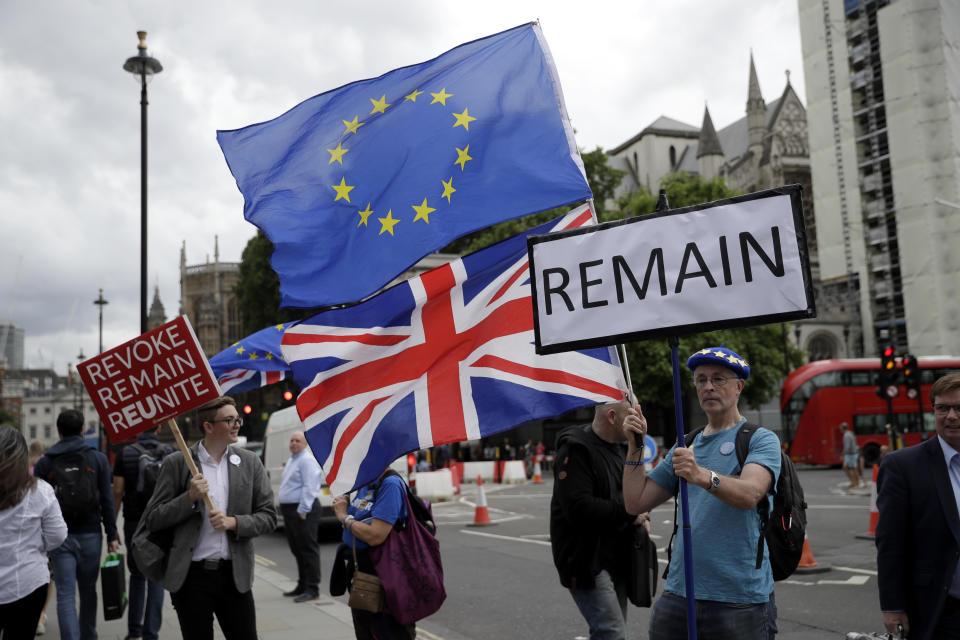 Anti-Brexit remain supporters protest outside the Houses of Parliament in London, Thursday, June 20, 2019. The contest to become Britain's next prime minister is down to its final three candidates, with Environment Secretary Michael Gove and Foreign Secretary Jeremy Hunt chasing front-runner Boris Johnson for a spot in a deciding runoff. (AP Photo/Matt Dunham)