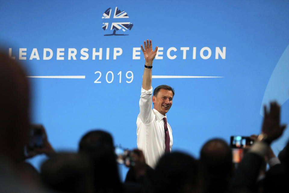 Conservative party leadership candidate Jeremy Hunt leaves the stage after a Conservative leadership hustings at ExCel Centre in London, Wednesday, July 17, 2019. The two contenders, Jeremy Hunt and Boris Johnson are competing for votes from party members, with the winner replacing Prime Minister Theresa May as party leader and Prime Minister of Britain's ruling Conservative Party. (AP Photo/Frank Augstein)