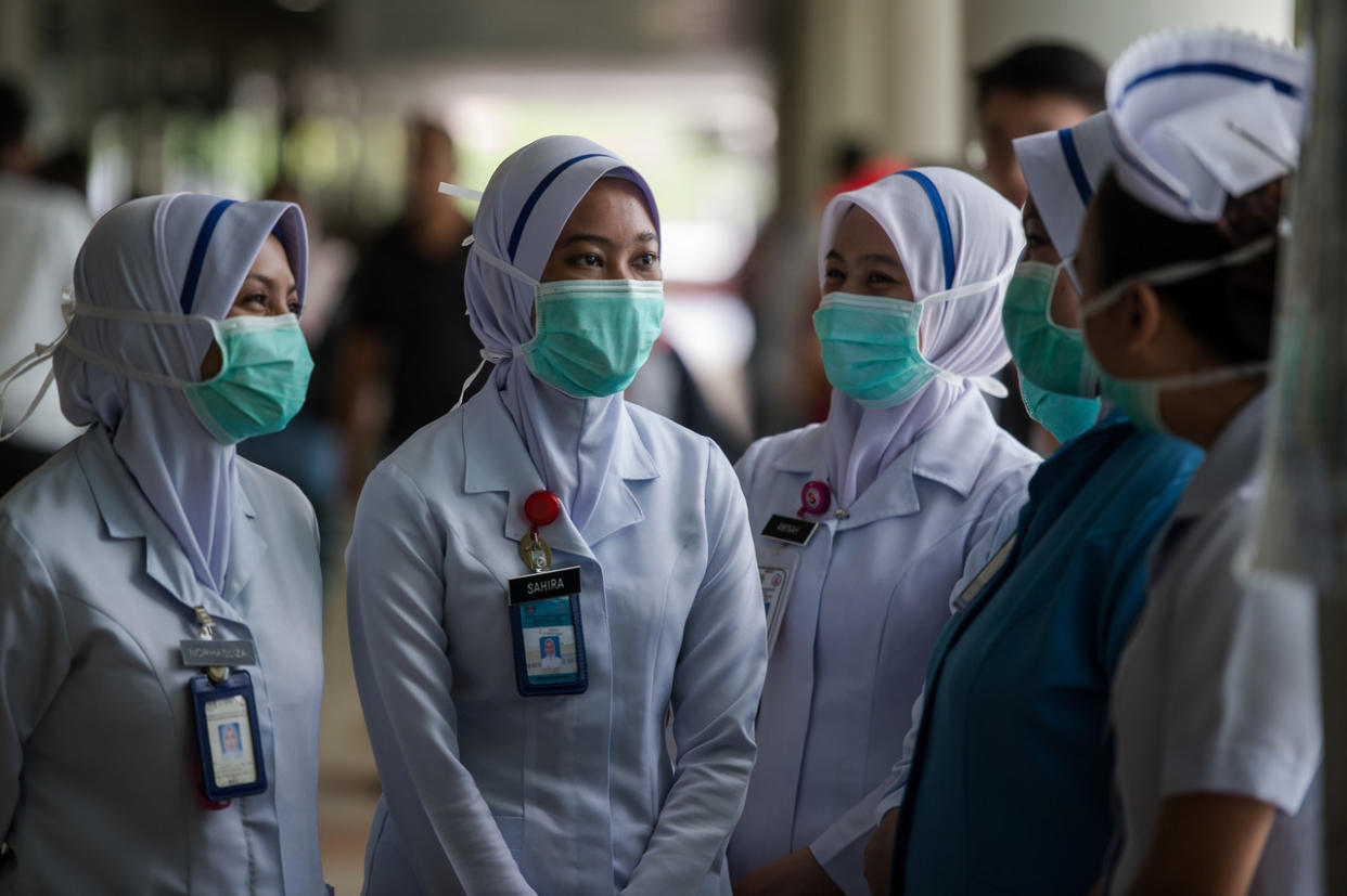 Medical personnel are seen at a hospital in Kuala Lumpur March 20, 2020. Health director-general Datuk Dr Noor Hisham Abdullah said 2,359 volunteers from various areas of healthcare across the country have been working with the MOH since the beginning of the outbreak and he is working to secure contracts for them. — Bernama pic