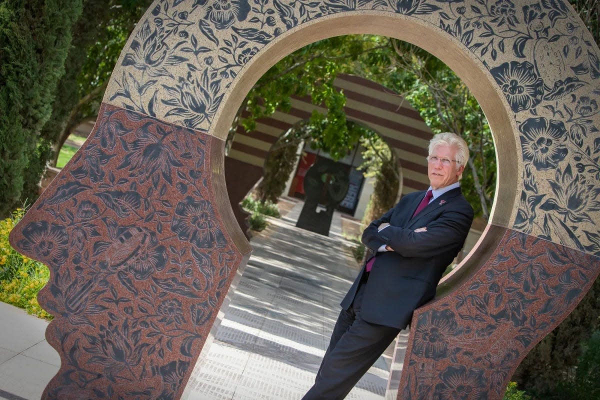 Richard Lange, president of Texas Tech University Health Sciences Center El Paso and dean of the Paul L. Foster School of Medicine, poses inside "El Intercambio," a series of engraved sculptures that reference science and nature, July 1, 2024.