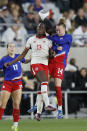 Canada's Simi Awujo, left, and United States' Emily Sonnett jump to head the ball during the first half of a SheBelieves Cup soccer match Tuesday, April 9, 2024, in Columbus, Ohio. (AP Photo/Jay LaPrete)
