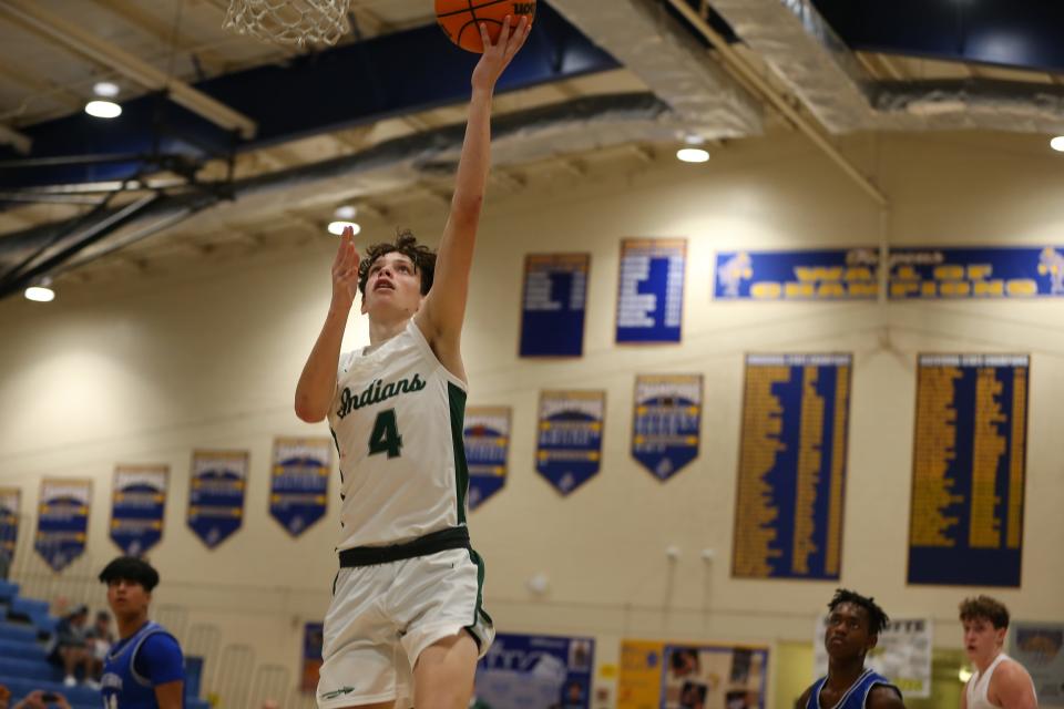 Kade Slaton of Venice drives to the basket against Fort Myers Canterbury on Saturday in the 17th Annual Wally Keller Classic on Saturday at Charlotte High.