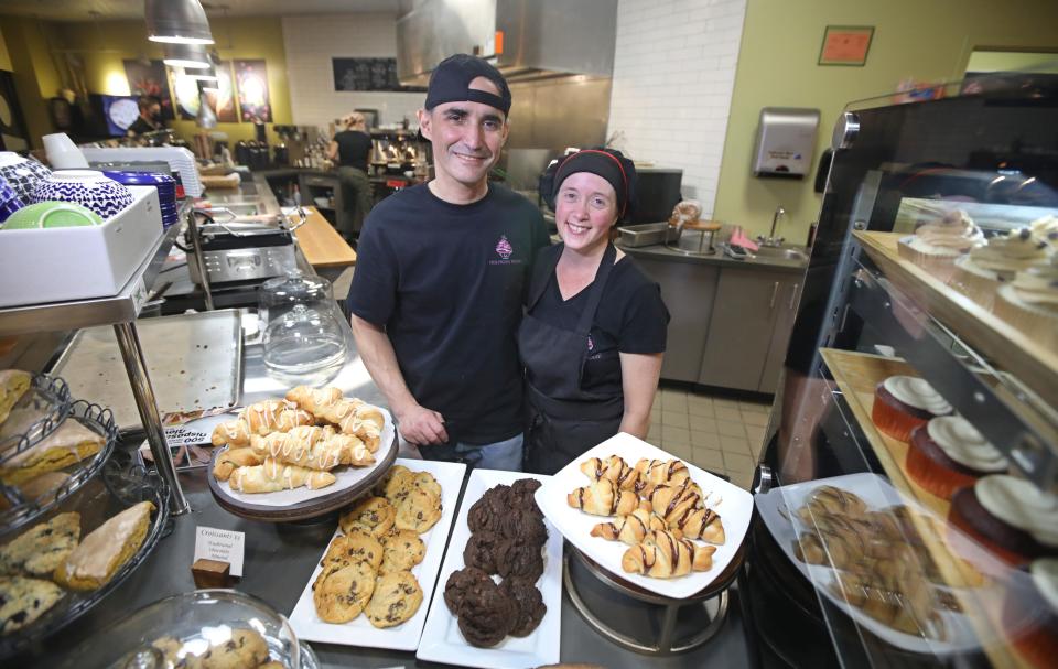 Owners Holly and Charles Bianchi behind the counter in their newly opened Hollycake House Vegan Cafe and Bakery in East Rochester Tuesday, Nov. 2, 2021.  The pair took off the masks that they were wearing for this photo. 