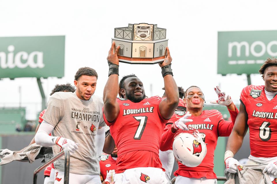 Dec 17, 2022; Boston, MA, USA; Louisville Cardinals linebacker Monty Montgomery (7) celebrates winning the Wasabi Bowl at Fenway Park. Mandatory Credit: Eric Canha-USA TODAY Sports