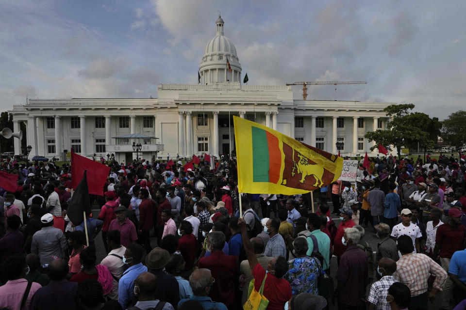 Members of Sri Lanka's opposition political party National People's Power participate in an anti-government protest rally in Colombo, Sri Lanka, Tuesday, April 19, 2022. Sri Lanka’s prime minister said Tuesday the constitution will be changed to clip presidential powers and empower Parliament as protesters continued to call on the president and his powerful family to quit over the country's economic crisis. (AP Photo/Eranga Jayawardena)
