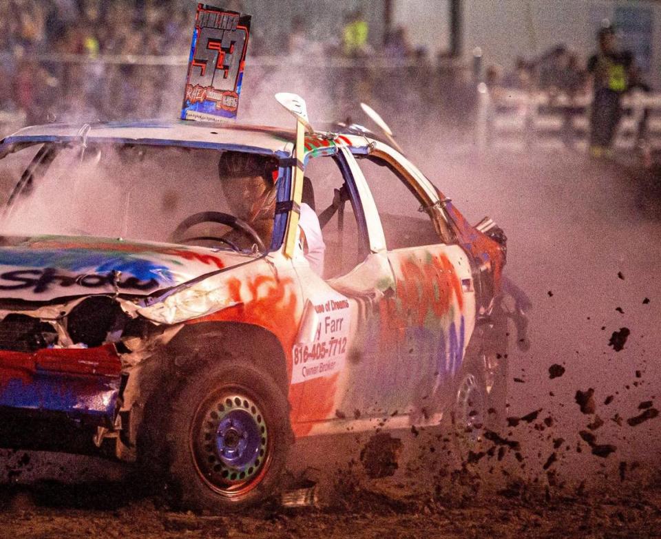 Kelby Dean gains speed in the third heat of the compact car category at the Demolition Derby at the Platte County Fair, Thursday, July 22, 2021, in Tracy, Missouri.