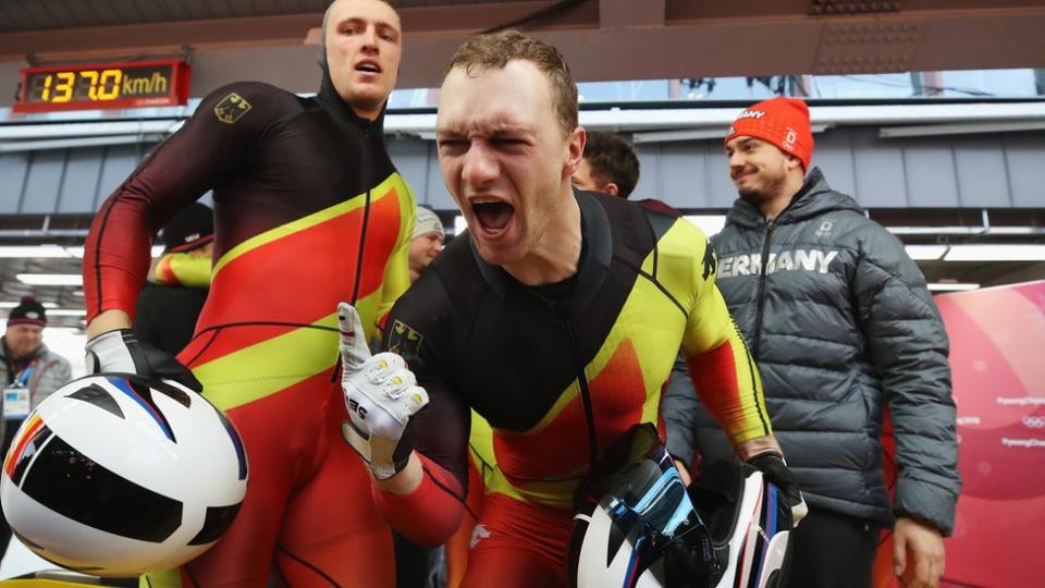 Francesco Friedrich (R) and Thorsten Margis of Germany celebrate winning gold as they finish their final run during the 4-man Boblseigh Heats on day sixteen of the PyeongChang 2018 Winter Olympic Games at Olympic Sliding Centre on February 25, 2018 in Pyeongchang-gun, South Korea