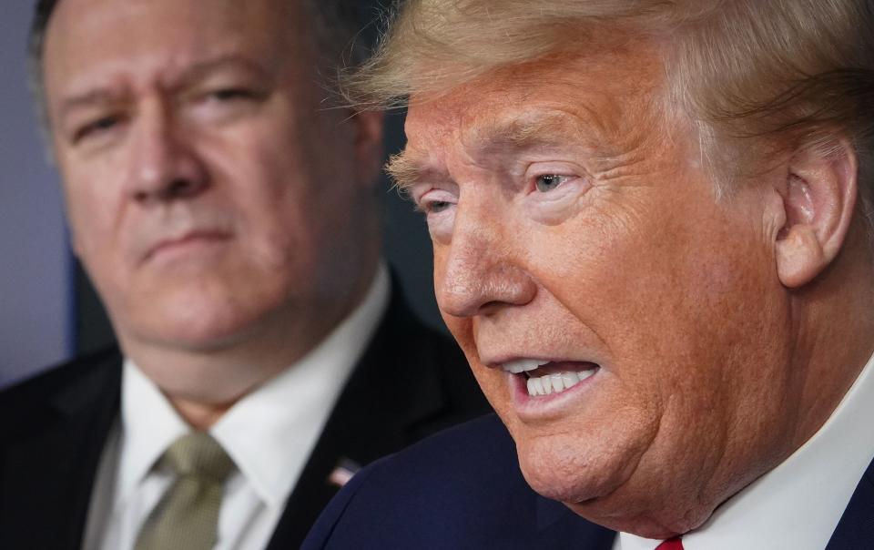 US Secretary of States Mike Pompeo listens as US President Donald Trump speaks during the daily briefing on the novel coronavirus, COVID-19, in the Brady Briefing Room at the White House on April 8, 2020, in Washington, DC. (Photo by MANDEL NGAN / AFP) (Photo by MANDEL NGAN/AFP via Getty Images)