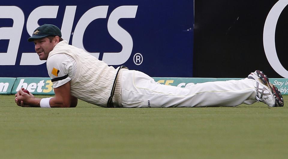 Australia's Ryan Harris looks on after taking a catch to dismiss England's Matt Prior during the fifth day's play in the second Ashes cricket test at the Adelaide Oval December 9, 2013. REUTERS/David Gray (AUSTRALIA - Tags: SPORT CRICKET)