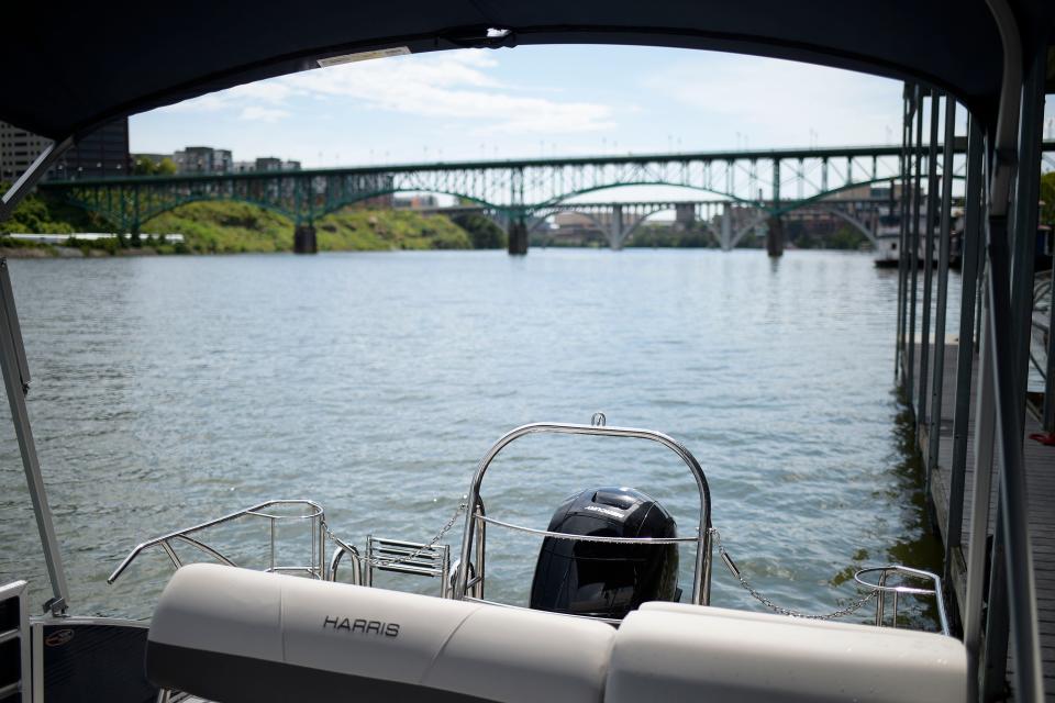 The Tennessee River and the Gay Street bridge are seen from a pontoon for reservation by the Freedom Boat Club Knoxville chapter at Volunteer Marina on July 27, 2022. The bridge began as a pontoon bridge used by the military during the Civil War.