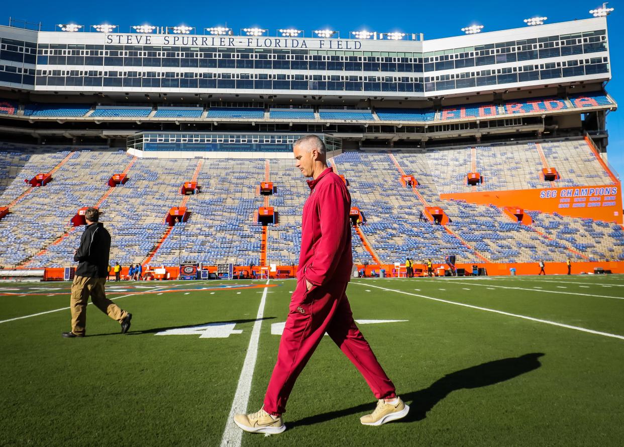 Florida State football coach Mike Norvell, seen here walking the field before last year's game against Florida, can't take any opponent like Duquesne for granted after what happened in 2021 against Jacksonville State.