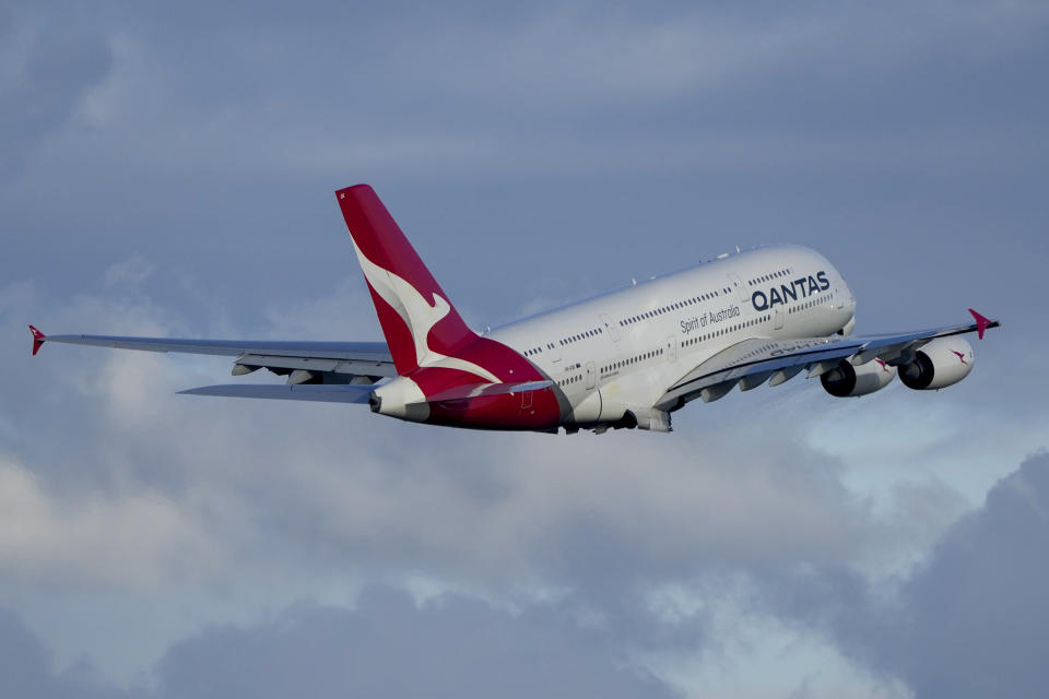 FILE - A Qantas A380 takes off from Sydney Airport over Botany Bay in Sydney, Australia, Monday, Sept. 5, 2022. Australian national carrier Qantas posted an underlying pre-tax half-year profit of 1.43 billion Australian dollars ($978 million) on Thursday, Feb. 23, 2023, in the airline's first return to profit since the coronavirus pandemic started three years ago. (AP Photo/Mark Baker/File)