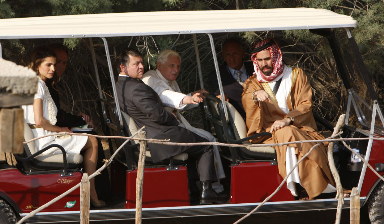 FILE - Pope Benedict XVI, accompanied by King Abdullah II of Jordan, second left, Queen Rania, left and Prince Ghazi bin Mohammed, right, visits the Bethany beyond the Jordan river, the site of Christ's baptism, west of Amman, Jordan, on May 10, 2009. Pope Emeritus Benedict XVI, the German theologian who will be remembered as the first pope in 600 years to resign, has died, the Vatican announced Saturday. He was 95. (AP Photo/Nasser Nasser, File)