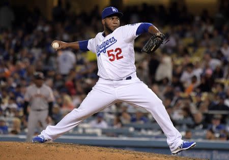 Apr 1, 2019; Los Angeles, CA, USA; Los Angeles Dodgers relief pitcher Pedro Baez (52) delivers a pitch against the San Francisco Giants at Dodger Stadium. Mandatory Credit: Kirby Lee-USA TODAY Sports