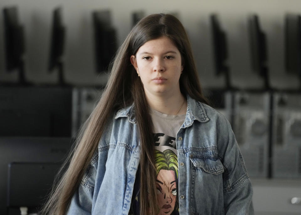 Olha Andrieieva, a Ukrainian student in Poland, prepares to take a Ukrainian final state examination at a center in Warsaw, Poland, Wednesday June 7, 2023. Russian forces have destroyed 262 educational institutions and damaged another 3,019 in their invasion of Ukraine, according to government figures. For those who've fled to other countries, schooling is suffering in unprecedented ways, according to families, educators, experts and advocates. The effects of war and relocation combined with the challenges of studying in a new country are compounding educational setbacks for young refugees. (AP Photo/Czarek Sokolowski)